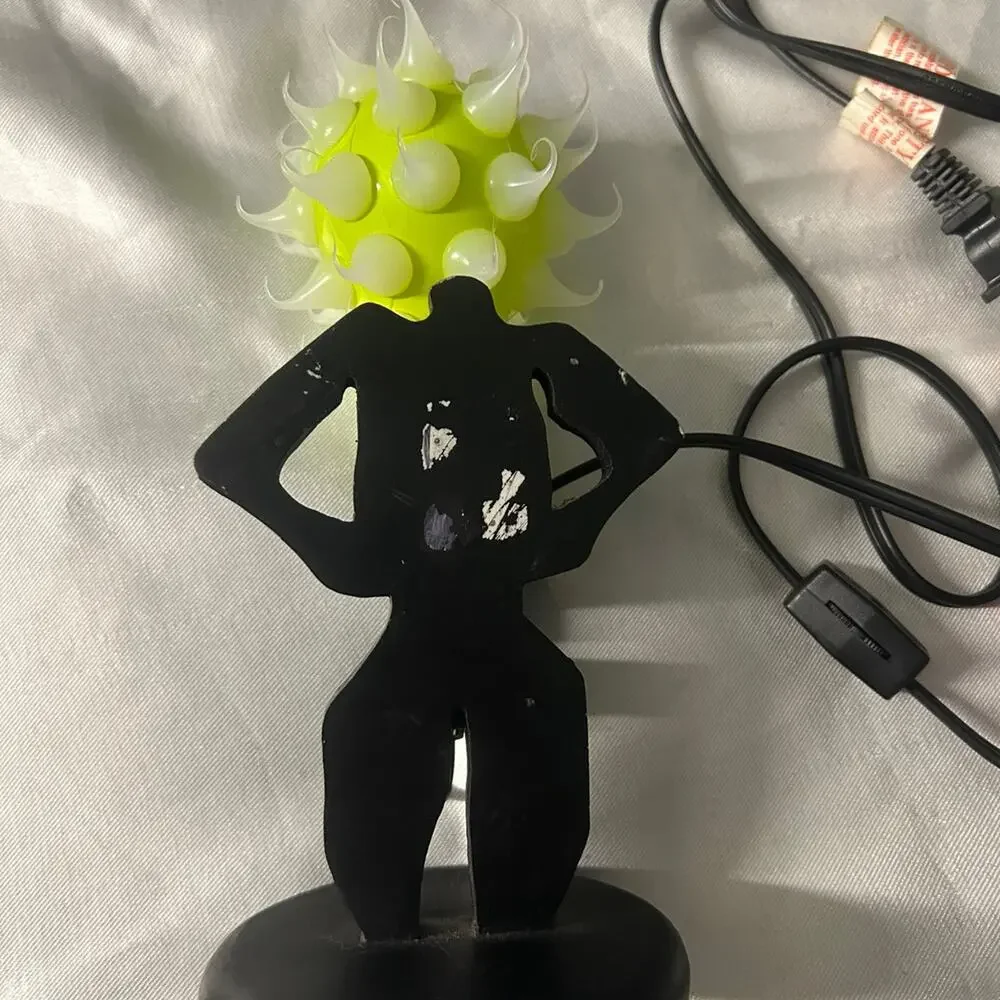 Lady shaped lamp with spikes yellow and purple light bulbs